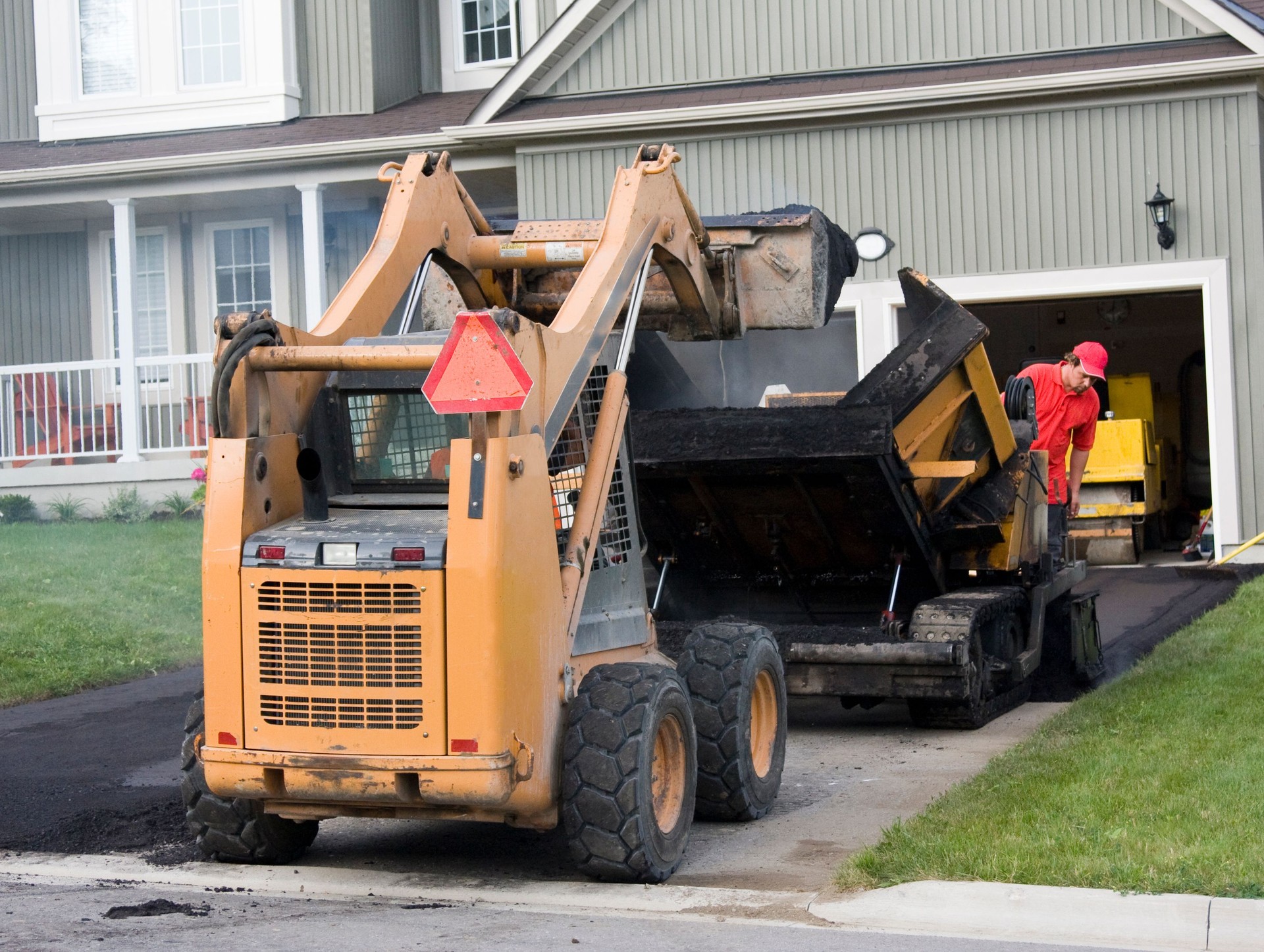 Loading Paving Machine With Asphalt
